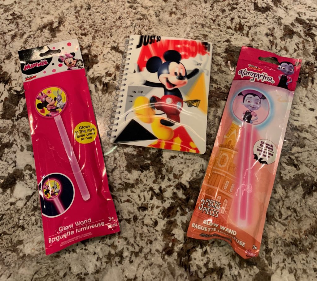 An autograph book and glow sticks purchased from the Dollar Store for an easy Disneyland hack