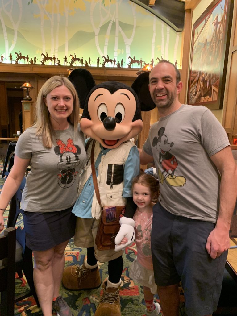 Family picture with Mickey Mouse at the Disneyland splurge of attending a character dining breakfast.