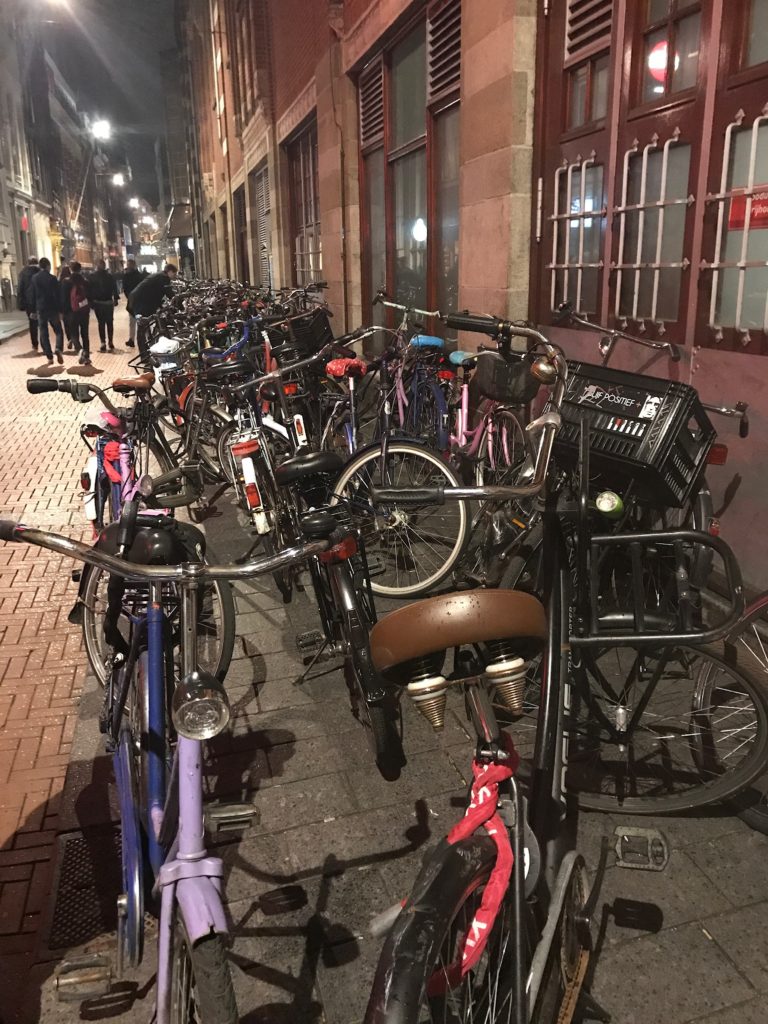 Bikes on street in amsterdam.