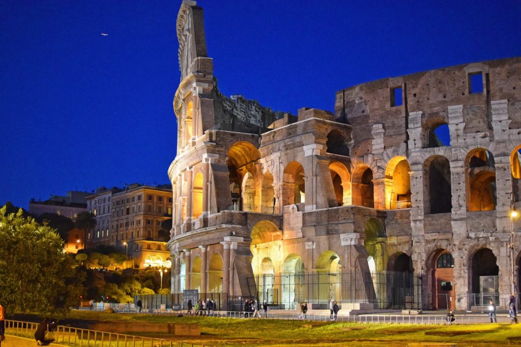Partial view of the exterior of the Colosseum in Rome at night