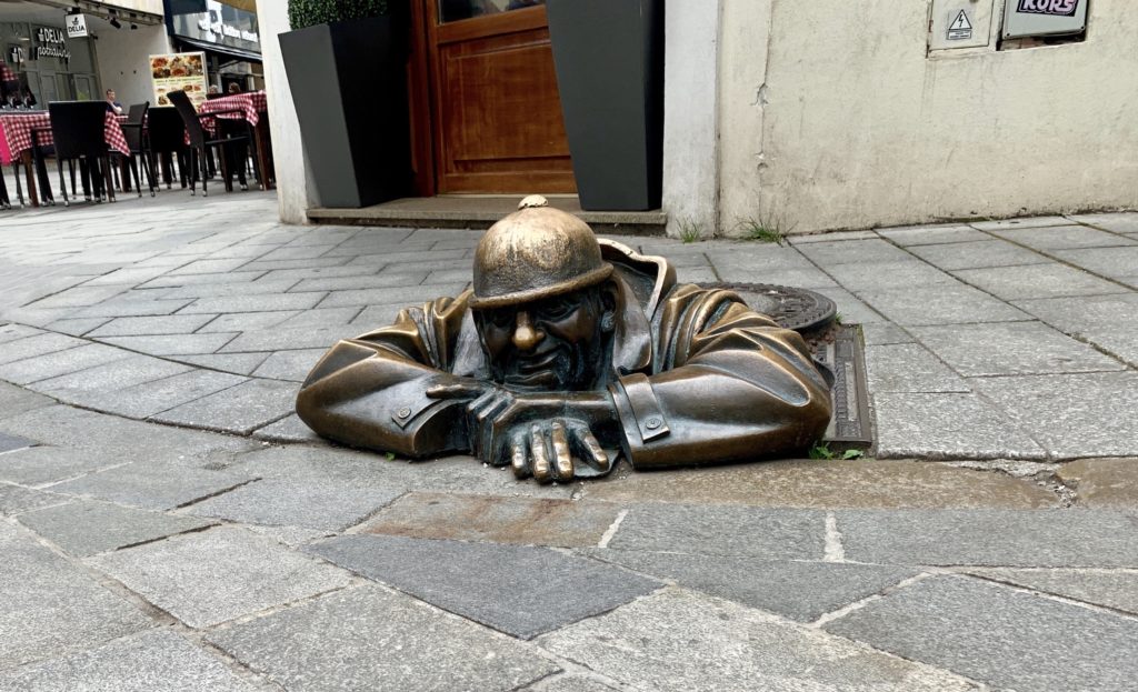 Visiting Cumil the sewer worker statue is one of the main Bratislava highlights.