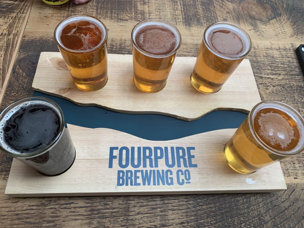 Tasting tray from Fourpure brewing co with 5 beers.
