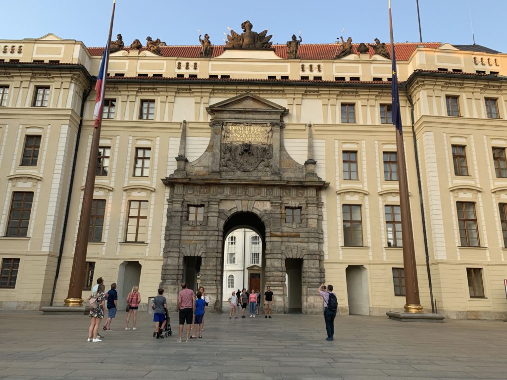 Tourists in front of the official office of the President of the Czech Republic in the Prague Castle complex