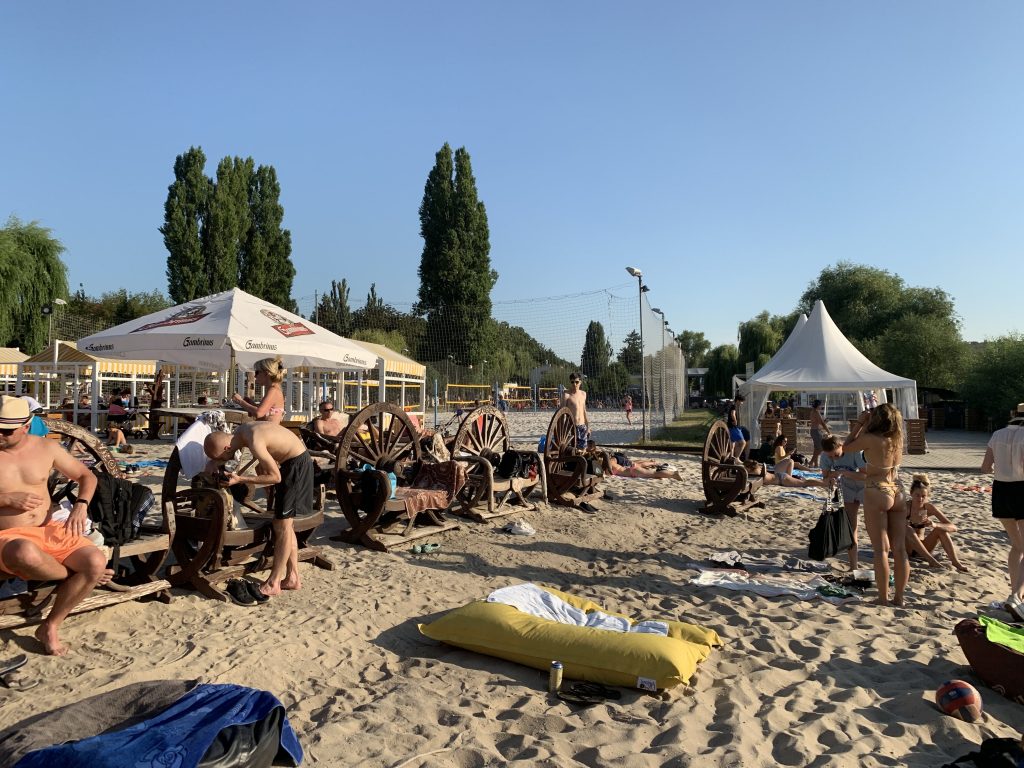people at the Zlute Lazne beach while spending the summer in prague