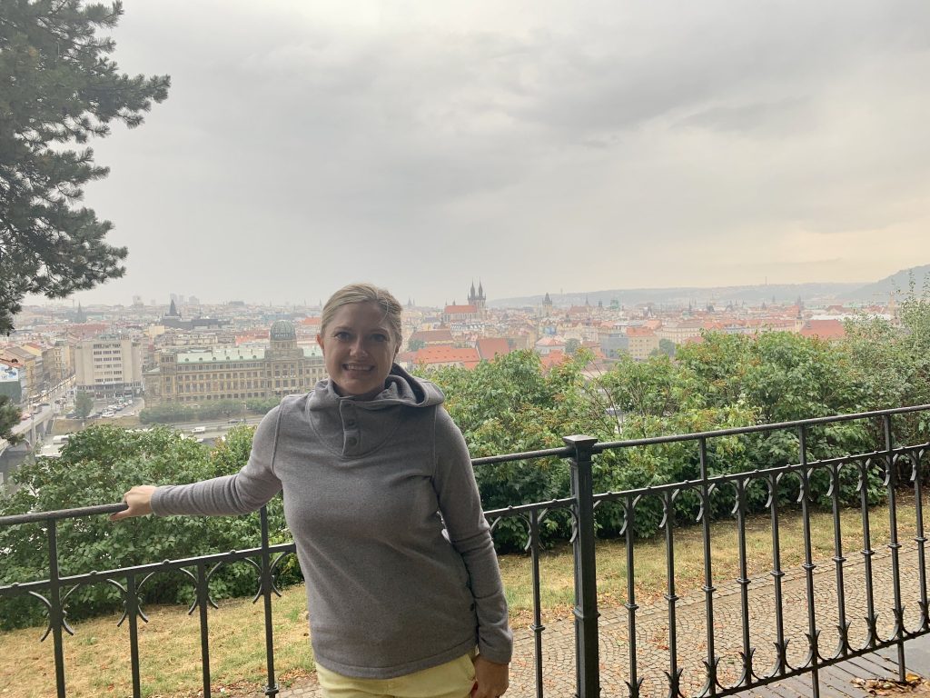 Female at letna park with view prague in the background